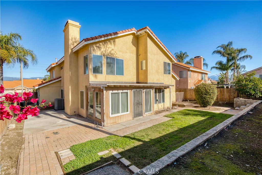 2136 East Colunga Street Colton, CA 92324 - Photo 38 of 40 a front view of a house with a yard