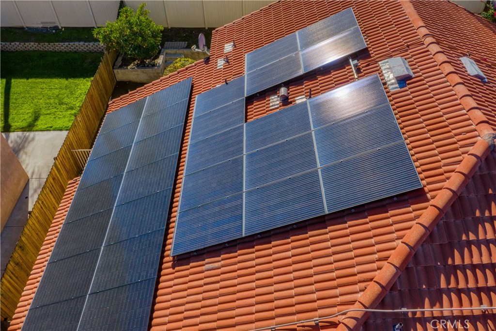 2136 East Colunga Street Colton, CA 92324 - Photo 39 of 40 a view of a yard with wooden fence and potted plants