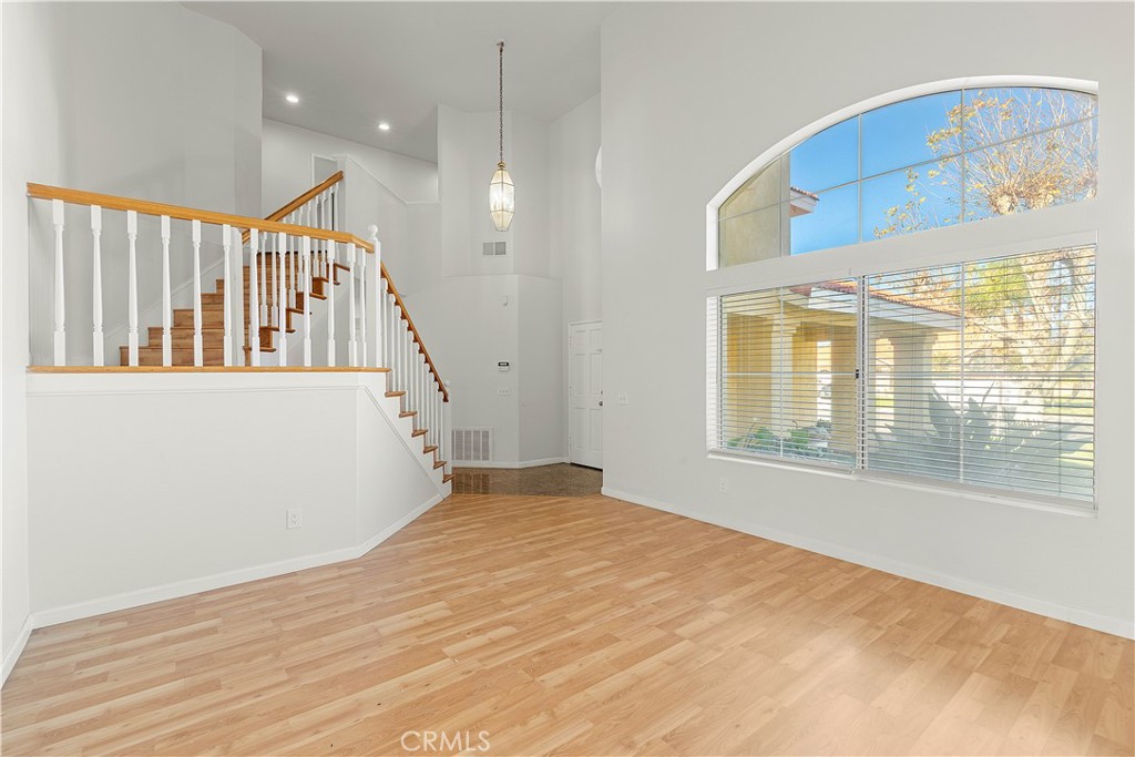 2136 East Colunga Street Colton, CA 92324 - Photo 10 of 40 a view of an empty room with wooden floor and a window