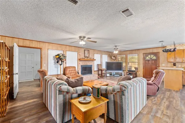 a kitchen with stainless steel appliances granite countertop a sink a stove and refrigerator