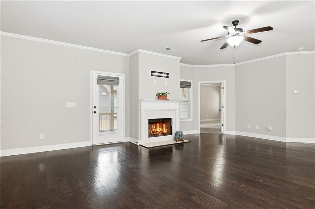 163 Hawthorne Ridge Circle Dallas, GA 30132 - Photo 14 of 50 a view of an empty room with window and wooden floor