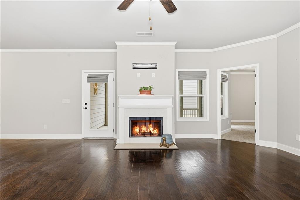163 Hawthorne Ridge Circle Dallas, GA 30132 - Photo 15 of 50 a living room with wooden floor and a fireplace