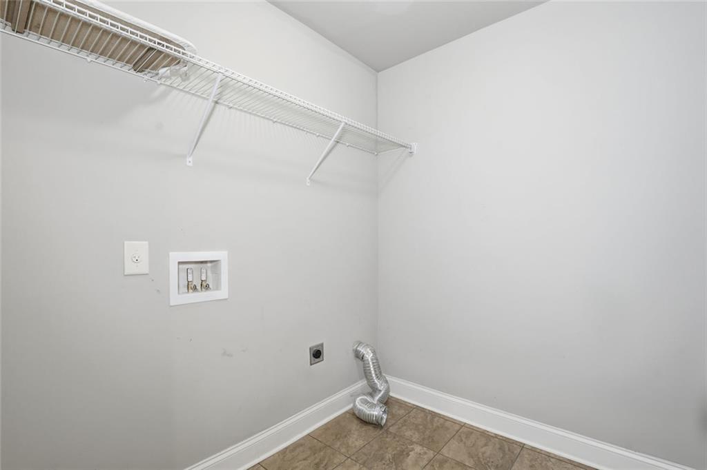 163 Hawthorne Ridge Circle Dallas, GA 30132 - Photo 23 of 50 a view of a room with racks on the wall