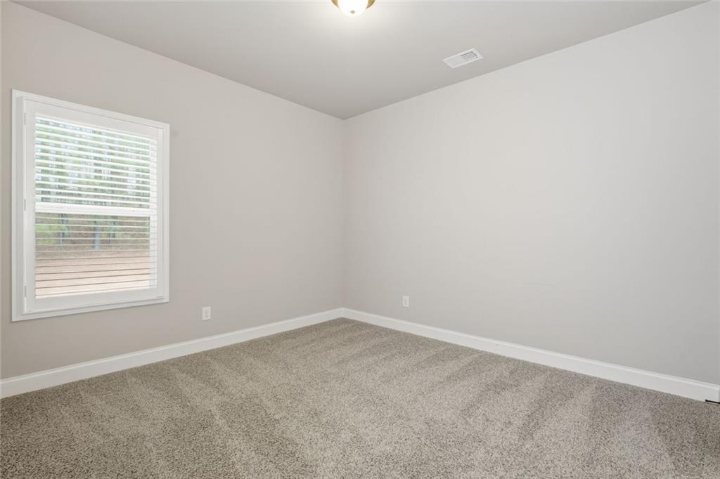 163 Hawthorne Ridge Circle Dallas, GA 30132 - Photo 24 of 50 an empty room with a window