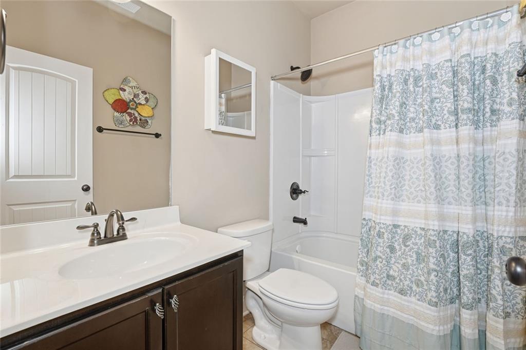163 Hawthorne Ridge Circle Dallas, GA 30132 - Photo 27 of 50 a bathroom with a sink toilet and shower