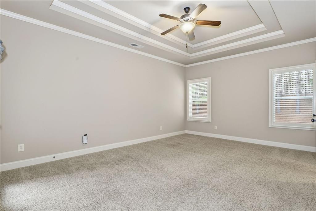 163 Hawthorne Ridge Circle Dallas, GA 30132 - Photo 28 of 50 an empty room with a window and a ceiling fan
