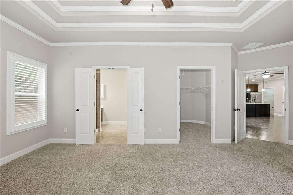 163 Hawthorne Ridge Circle Dallas, GA 30132 - Photo 31 of 50 an empty room with a cabinet and closet