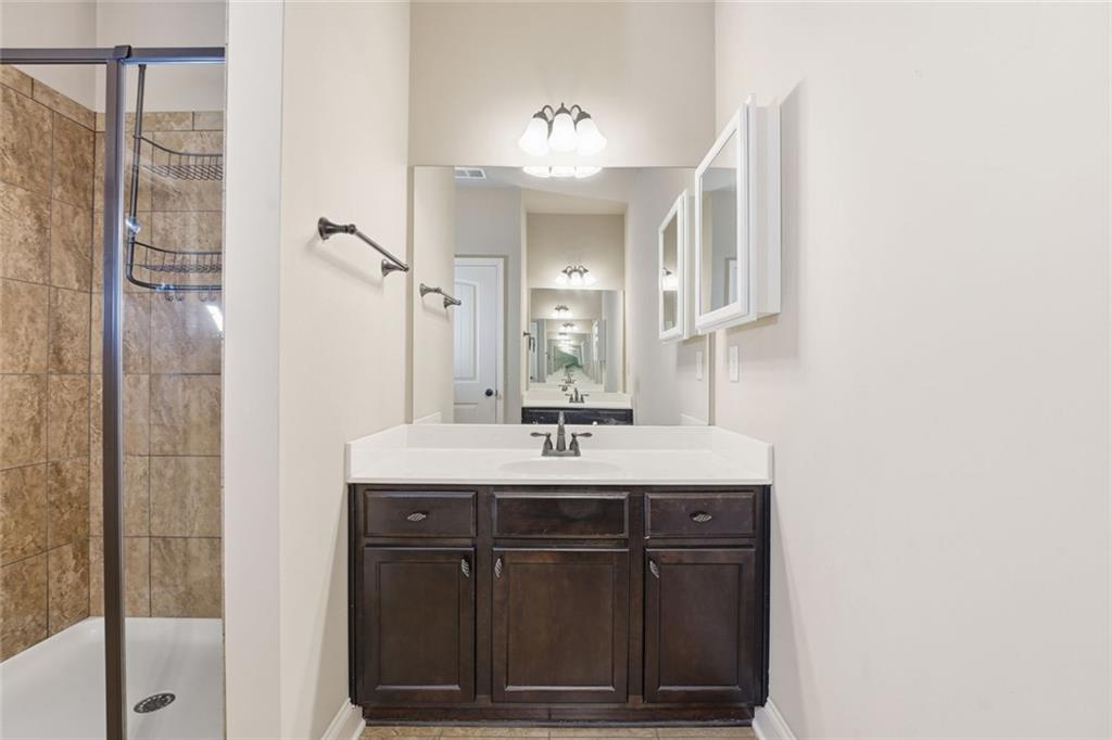 163 Hawthorne Ridge Circle Dallas, GA 30132 - Photo 34 of 50 a bathroom with a sink and a mirror