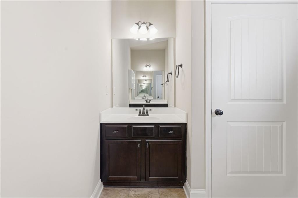 163 Hawthorne Ridge Circle Dallas, GA 30132 - Photo 35 of 50 a bathroom with a sink and a mirror