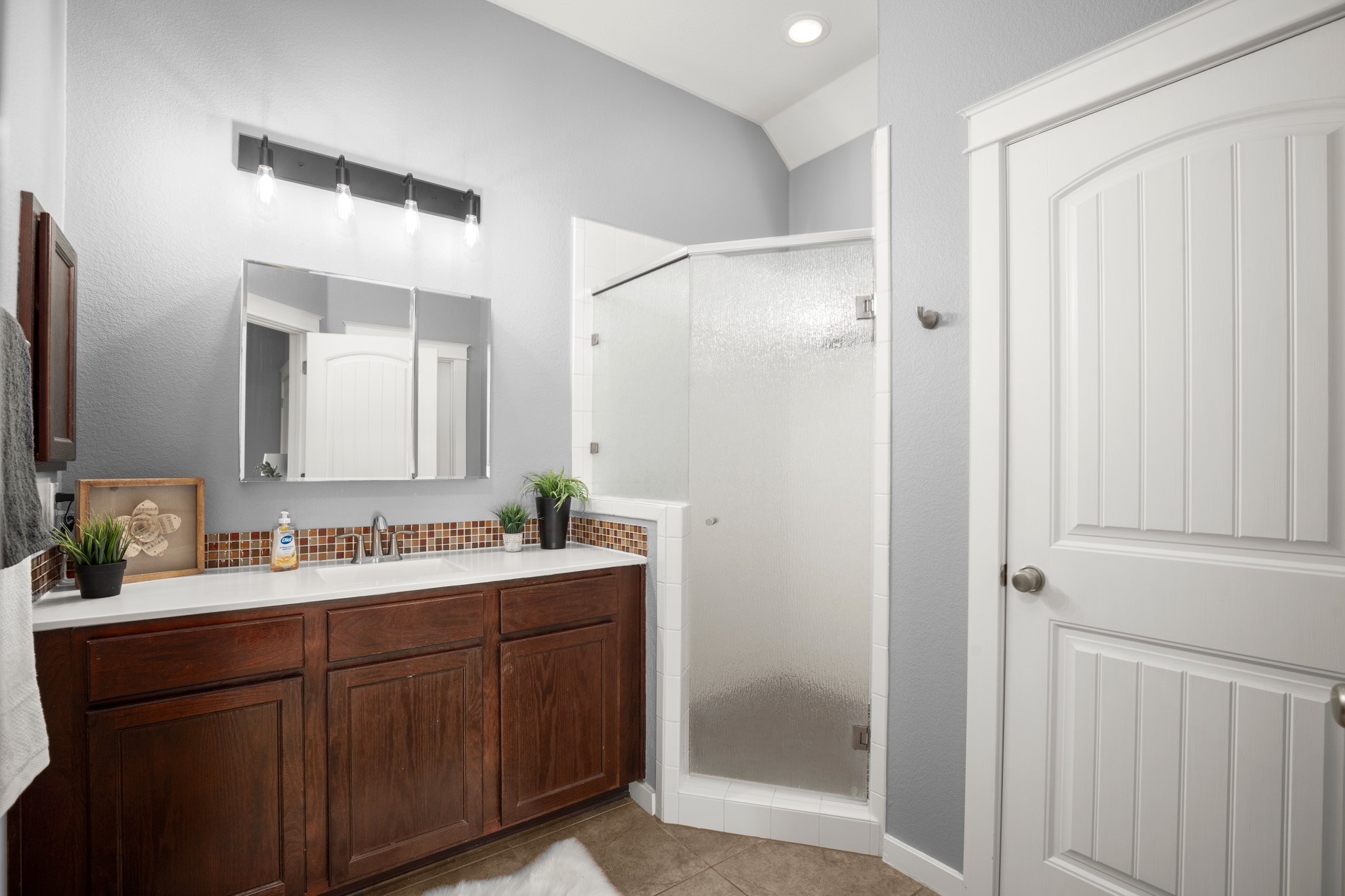 4644 Page Street Austin, TX 78723 - Photo 14 of 21 a bathroom with a double vanity sink mirror and double