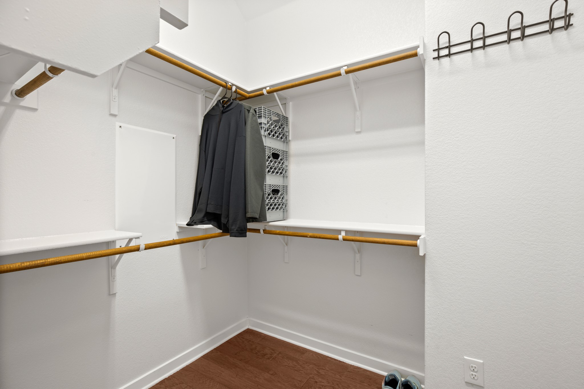 4644 Page Street Austin, TX 78723 - Photo 16 of 21 a view of walk in closet with clothes and shoes