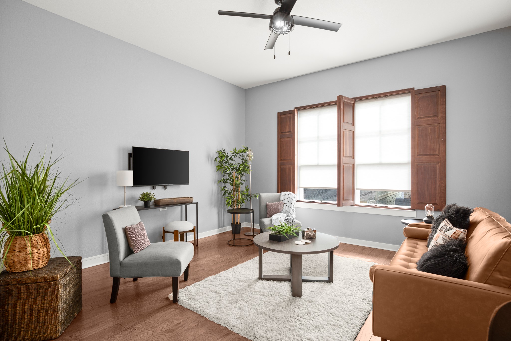 4644 Page Street Austin, TX 78723 - Photo 3 of 21 a living room with furniture a flat screen tv and a large window