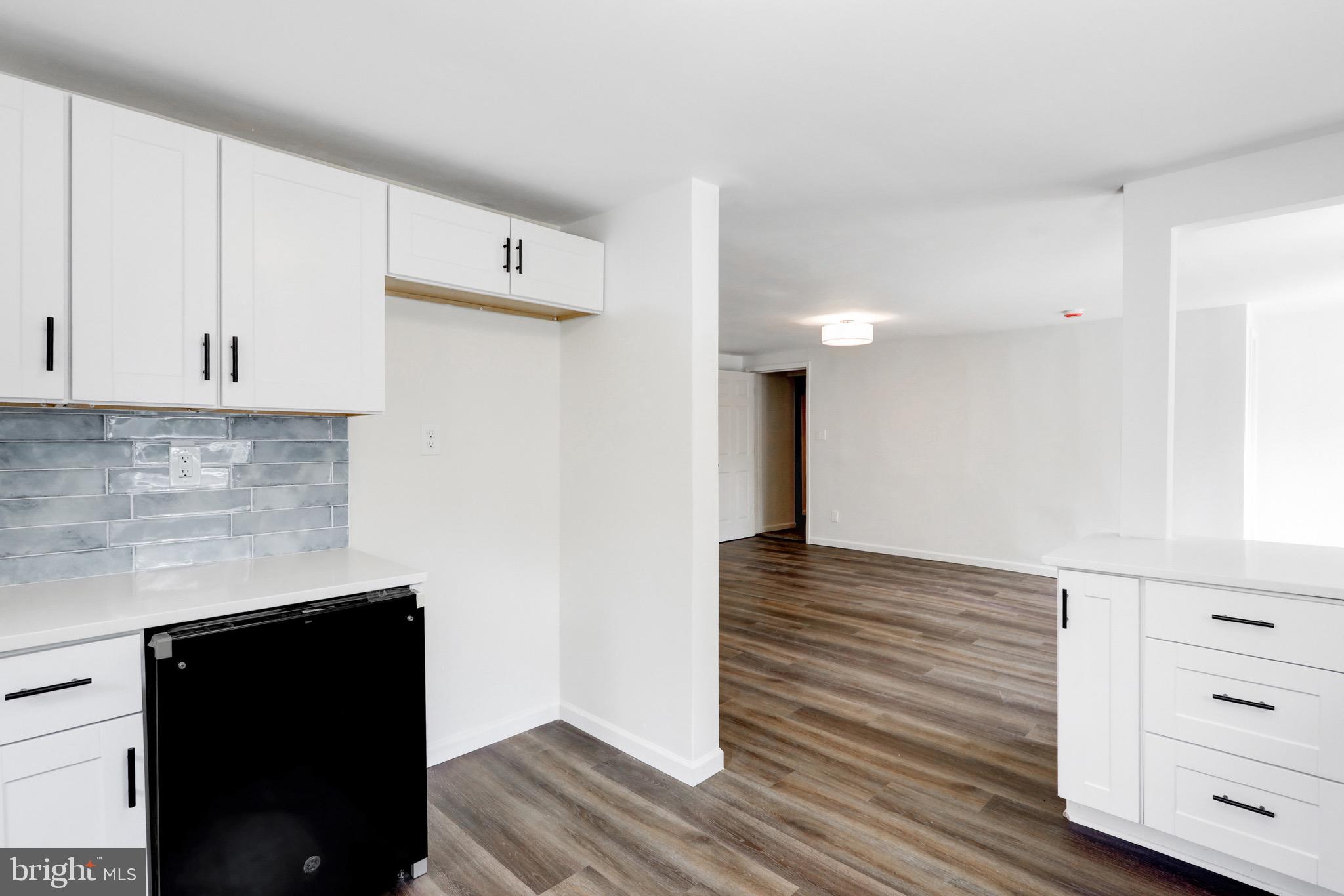 2145 Dunks Ferry Road Bensalem, PA 19020 - Photo 12 of 37 a kitchen with cabinets and wooden floor