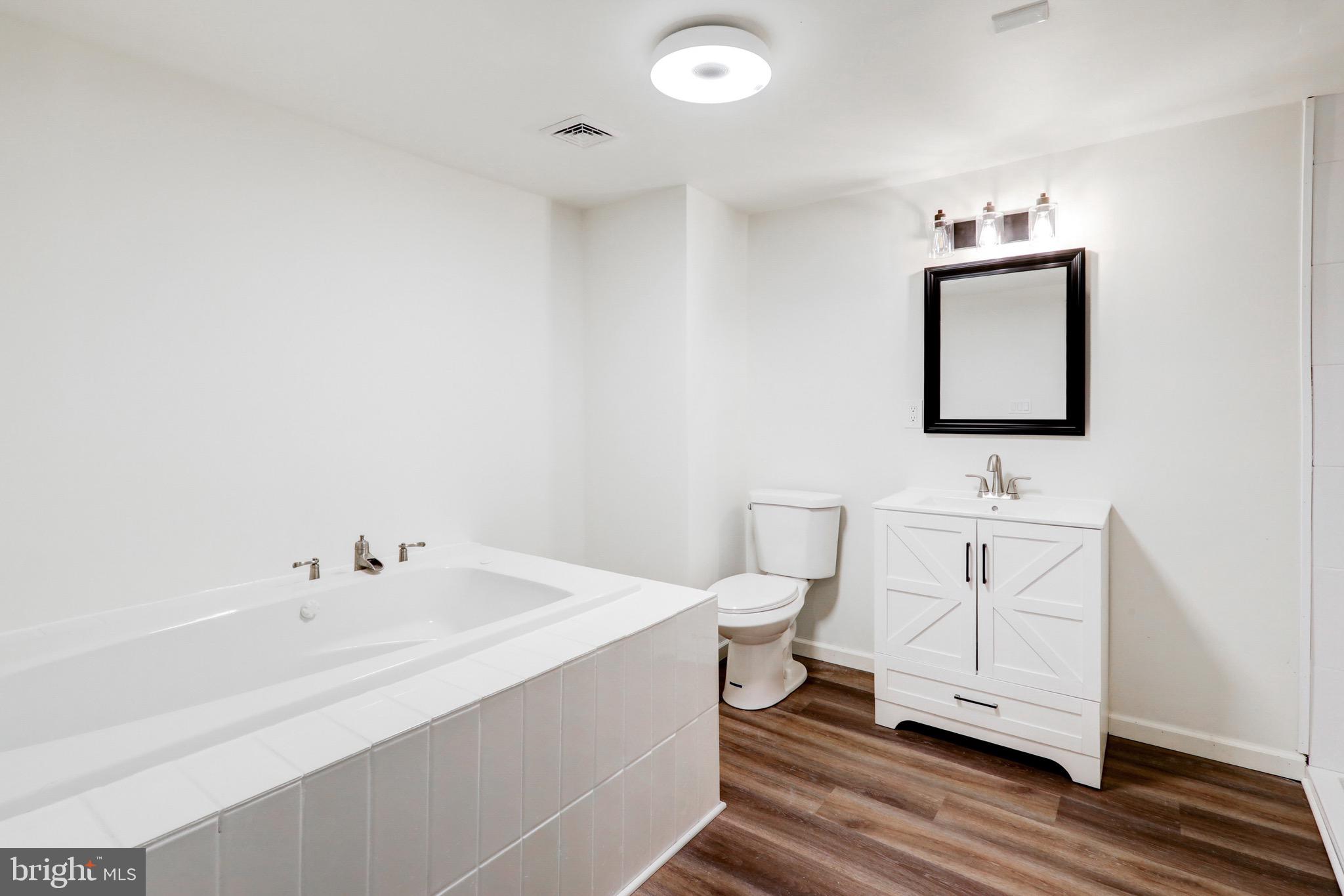 2145 Dunks Ferry Road Bensalem, PA 19020 - Photo 15 of 37 a bathroom with a sink toilet and vanity