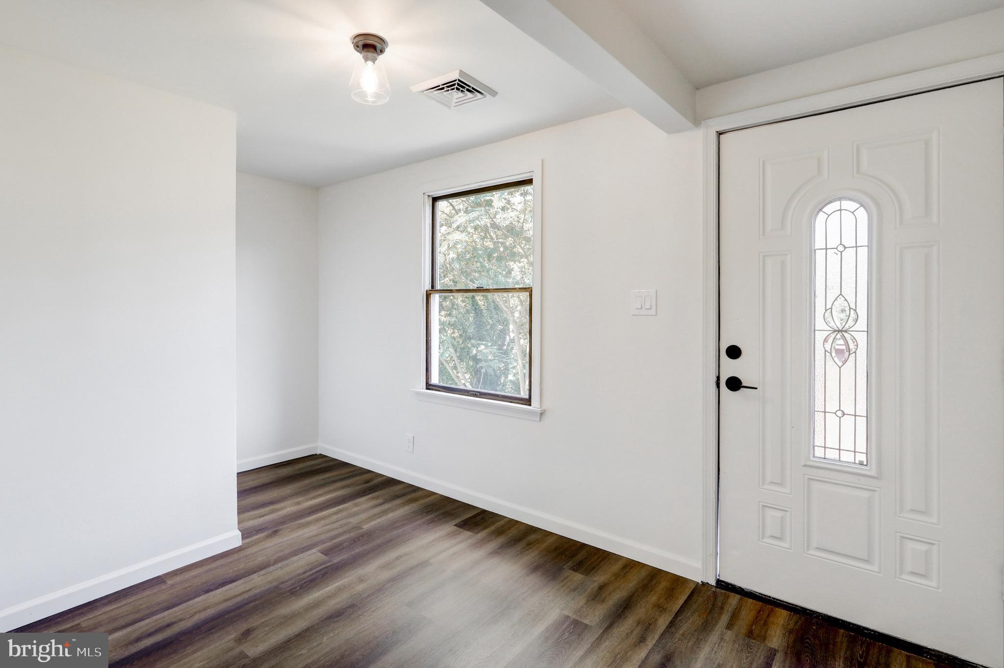 2145 Dunks Ferry Road Bensalem, PA 19020 - Photo 3 of 37 a view of empty room with wooden floor and fan