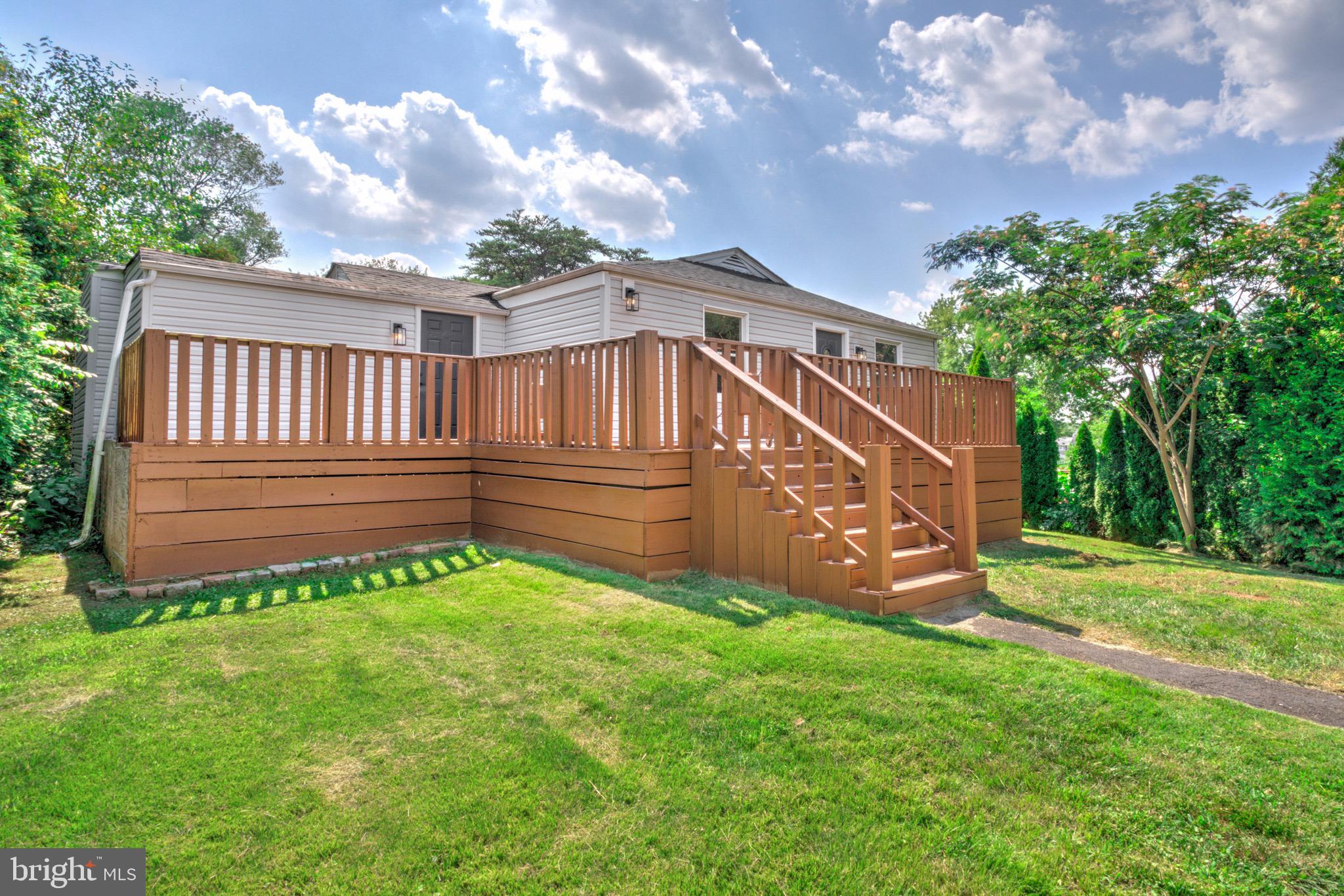 2145 Dunks Ferry Road Bensalem, PA 19020 - Photo 32 of 37 a view of a backyard with plants and a large tree