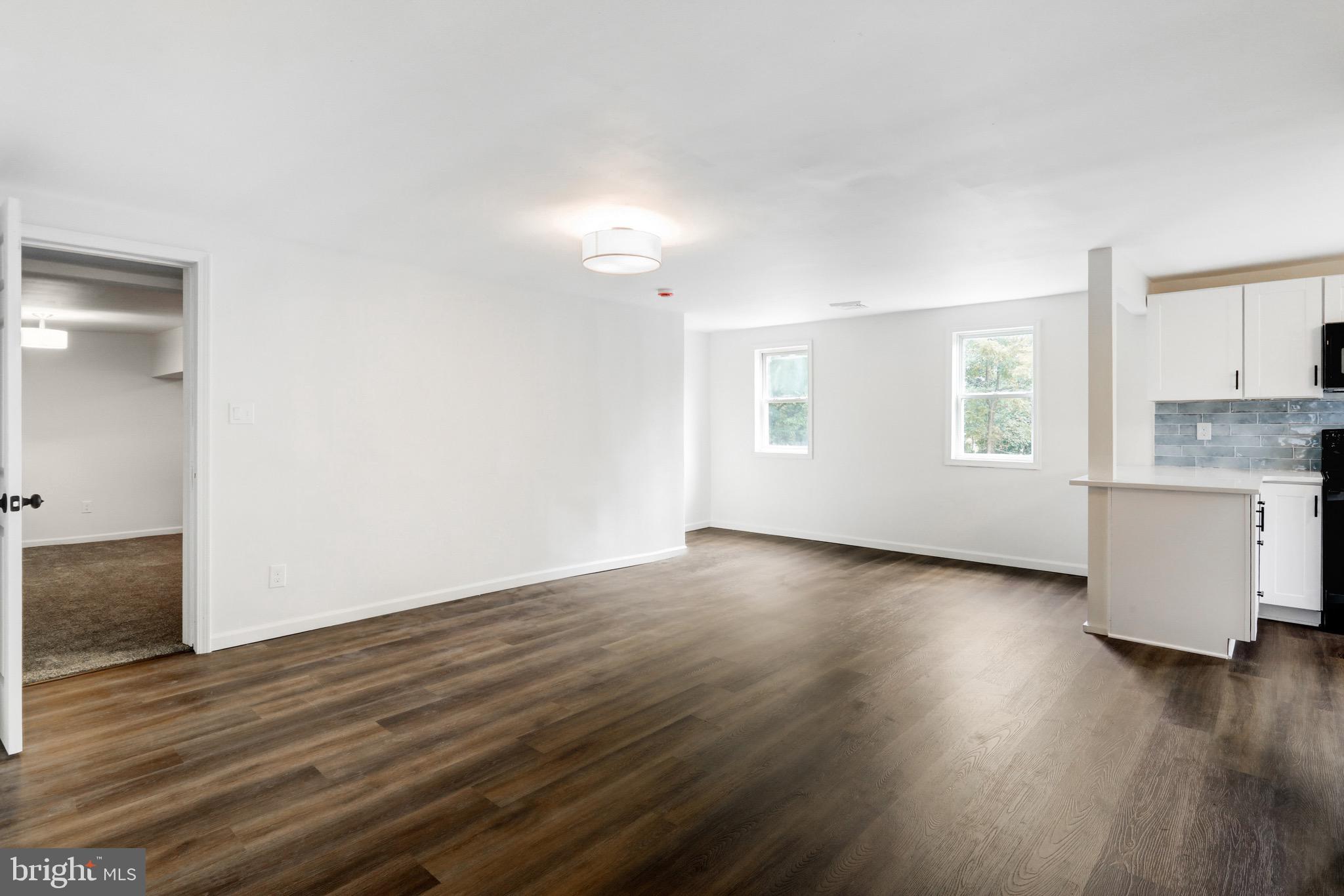 2145 Dunks Ferry Road Bensalem, PA 19020 - Photo 4 of 37 an empty room with wooden floor and windows