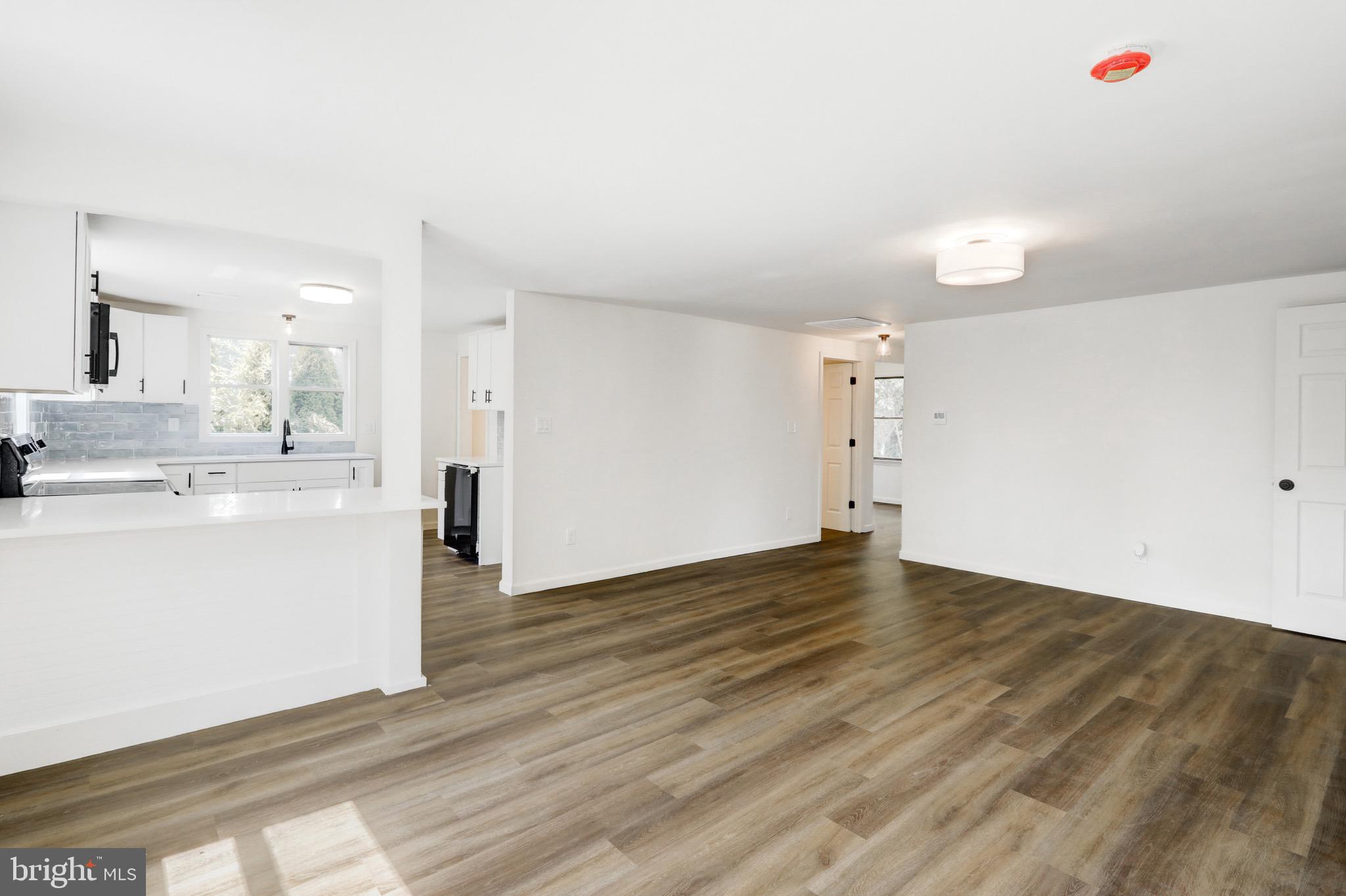 2145 Dunks Ferry Road Bensalem, PA 19020 - Photo 6 of 37 a view of a kitchen with wooden floor and a sink