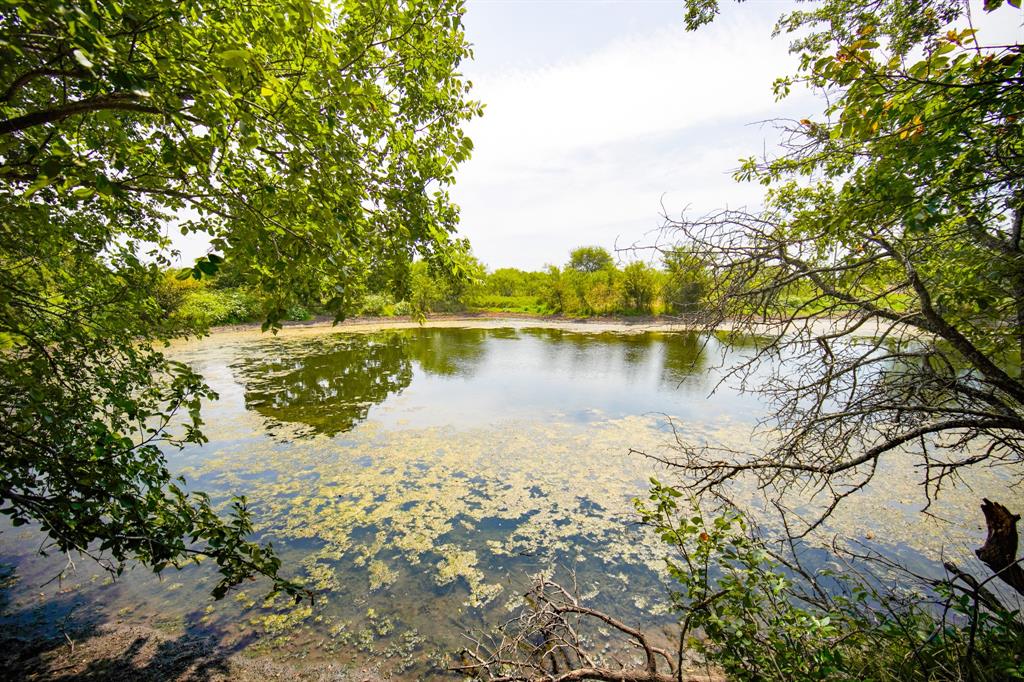 29.47-acres 29.47-acres Ballard Road Jacksboro, TX 76458 - Photo 16 of 26 a view of a lake with houses in the back