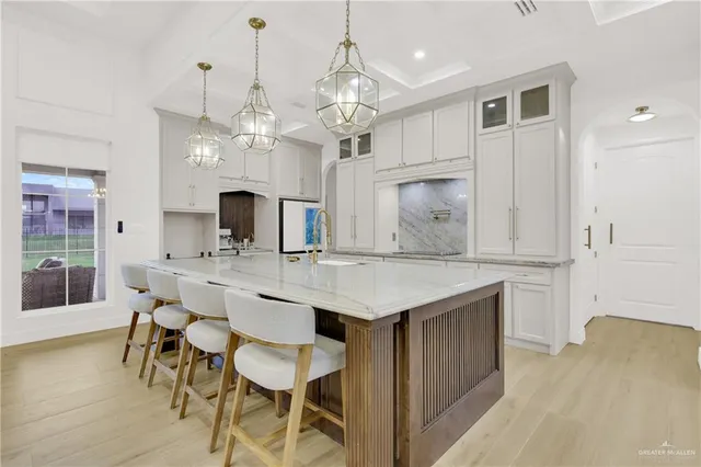 a kitchen with a table and chairs in it