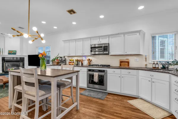 a kitchen with a sink cabinets and window
