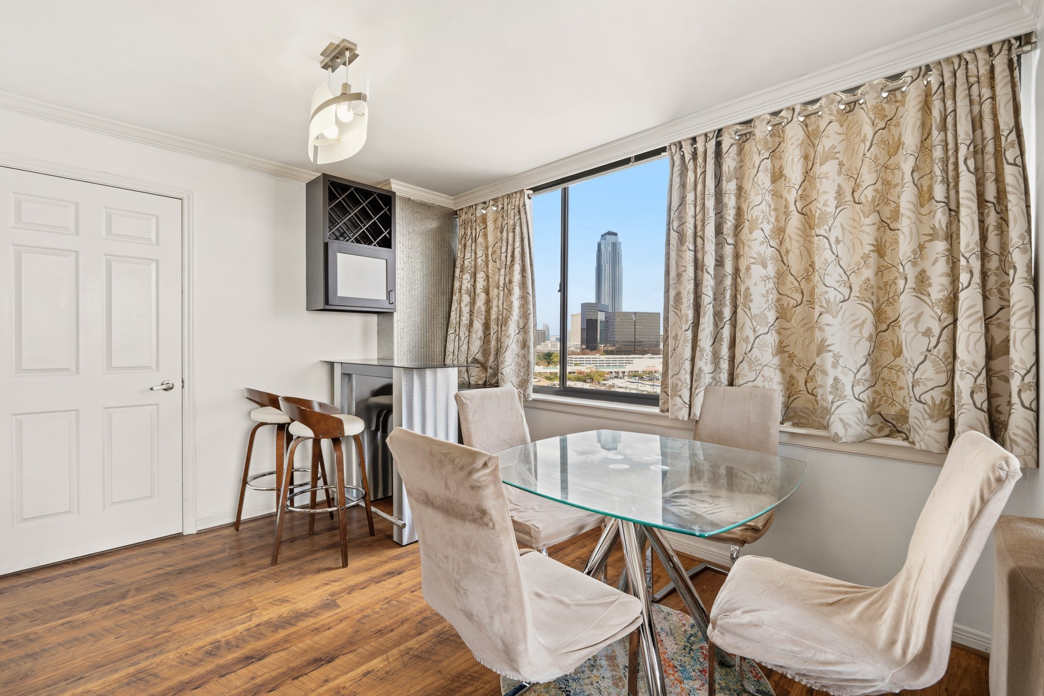 3525 Sage Road, Unit 1204 Houston, TX 77056 - Photo 4 of 25 Dining area with space for table seating and windows providing natural light.