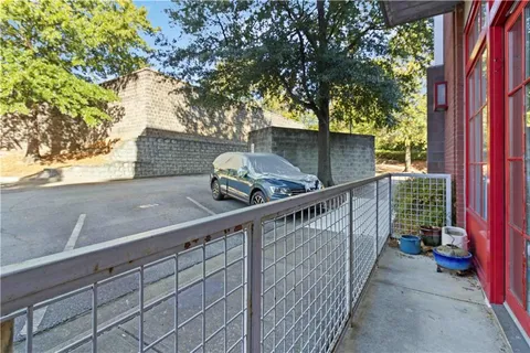 a view of a balcony with trees