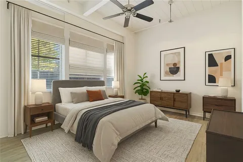 a bedroom with a large bed and a couch