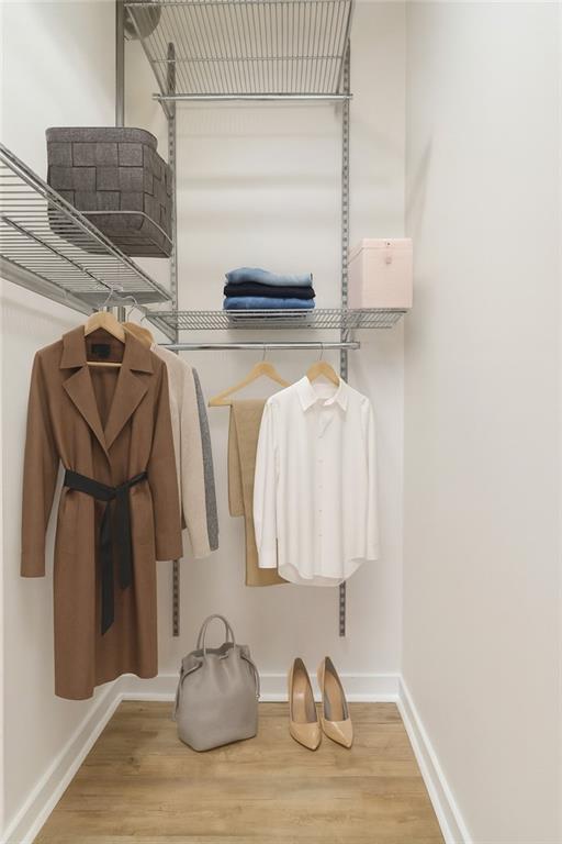 572 Edgewood Avenue Northeast, Unit 106 Atlanta, GA 30312 - Photo 4 of 17 a bathroom with a granite countertop sink and a mirror