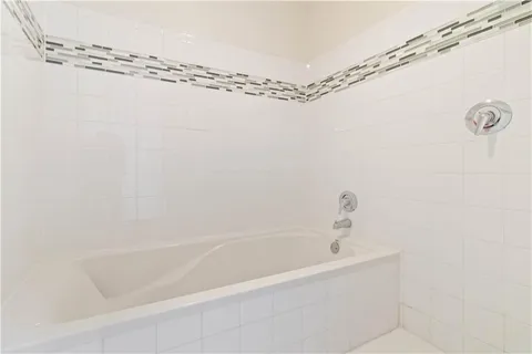 a close view of a bathtub in bathroom