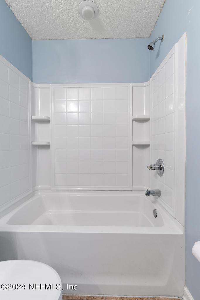 5902 Round Table Road Jacksonville, FL 32254 - Photo 20 of 44 a bathroom with a bathtub and a shower