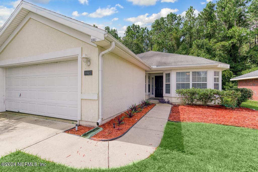 5902 Round Table Road Jacksonville, FL 32254 - Photo 2 of 44 a front view of a house with a yard