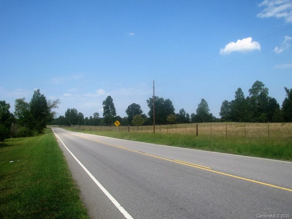 371 McFarland Road York, SC 29745 - Photo 4 of 8 a view of a golf course with a lake