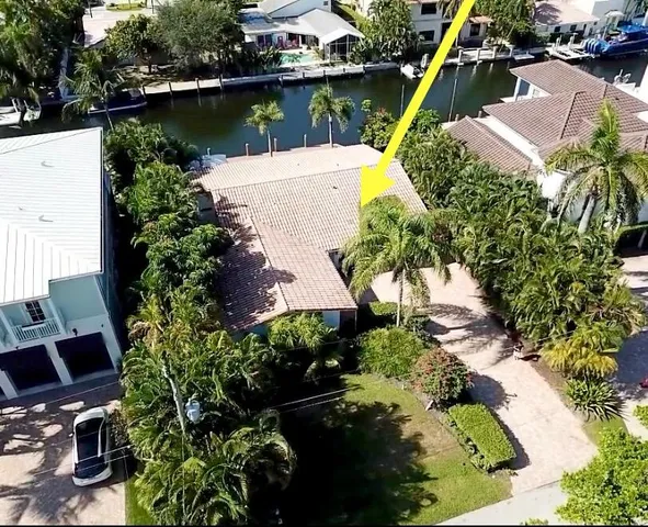 a view of a lake with a house in the background