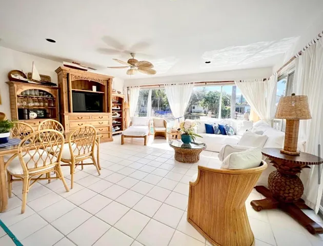 a living room with furniture fireplace and flat screen tv