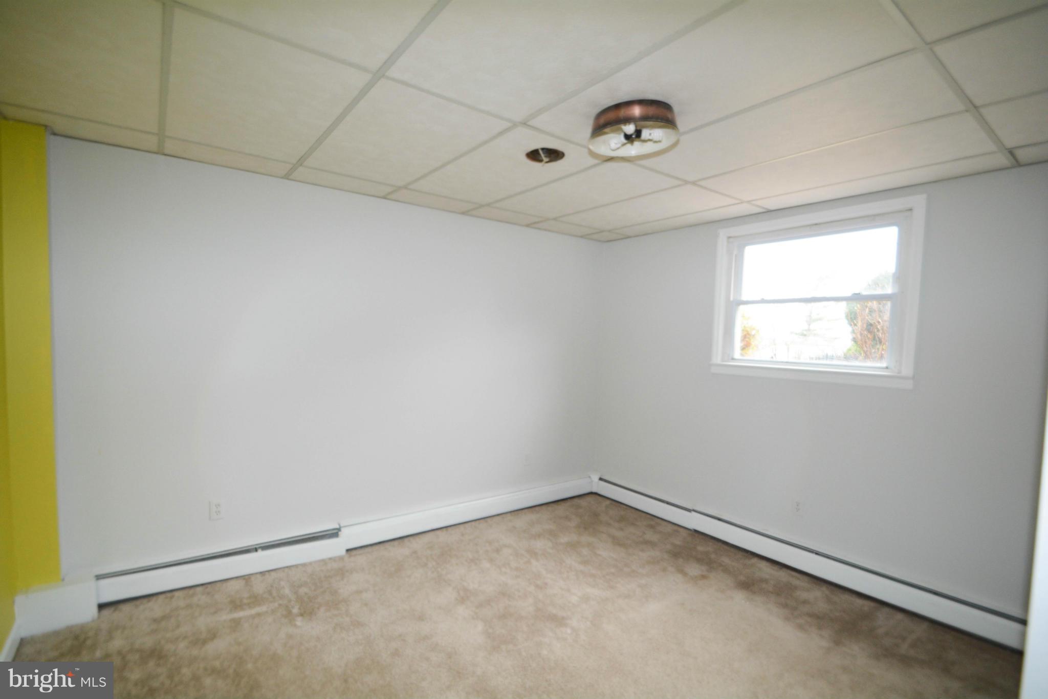2 Millgate Road Owings Mills, MD 21117 - Photo 22 of 24 an empty room with a empty space and windows