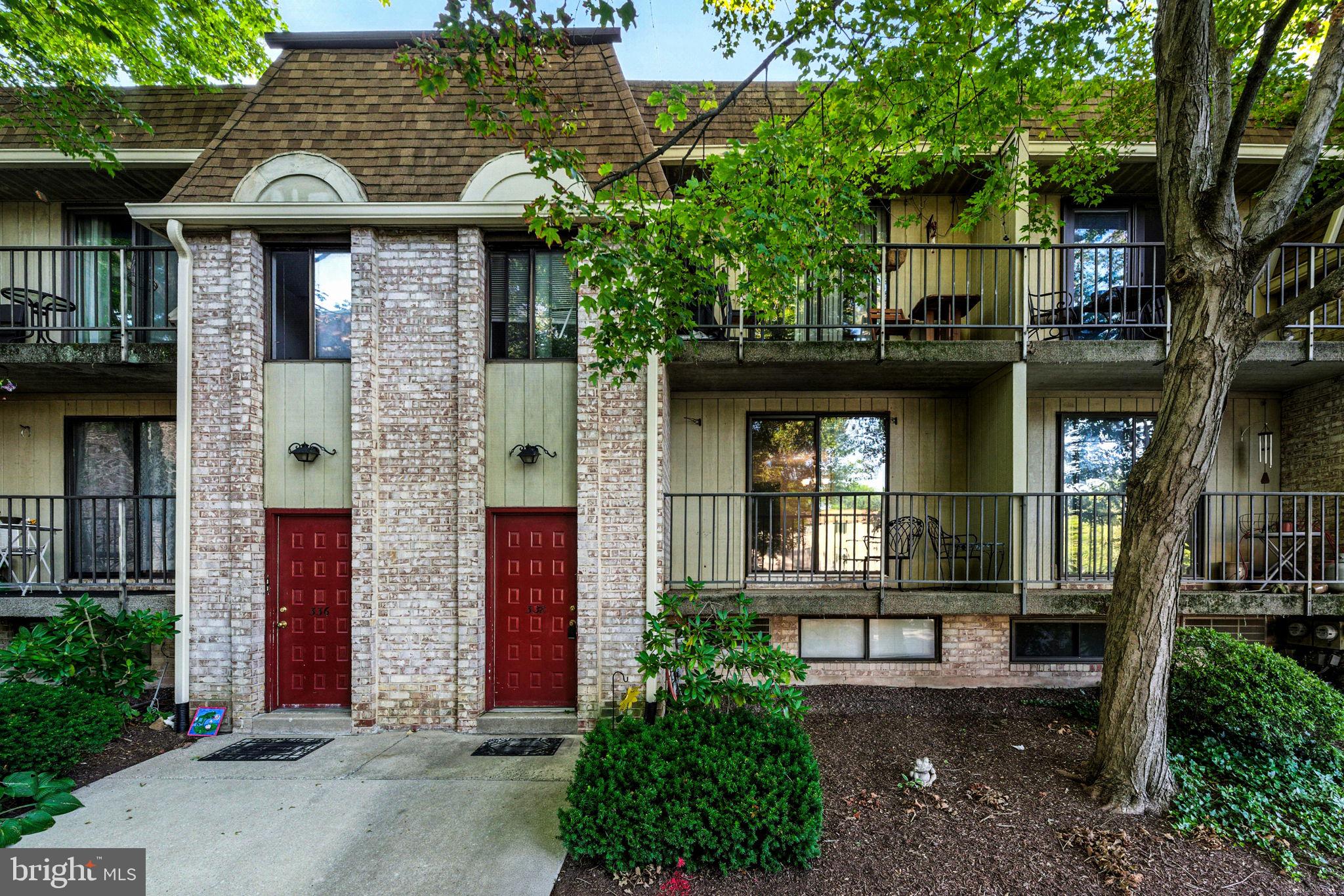 338 Saybrook Lane Wallingford, PA 19086 - Photo 1 of 30 a front view of a house with a garden