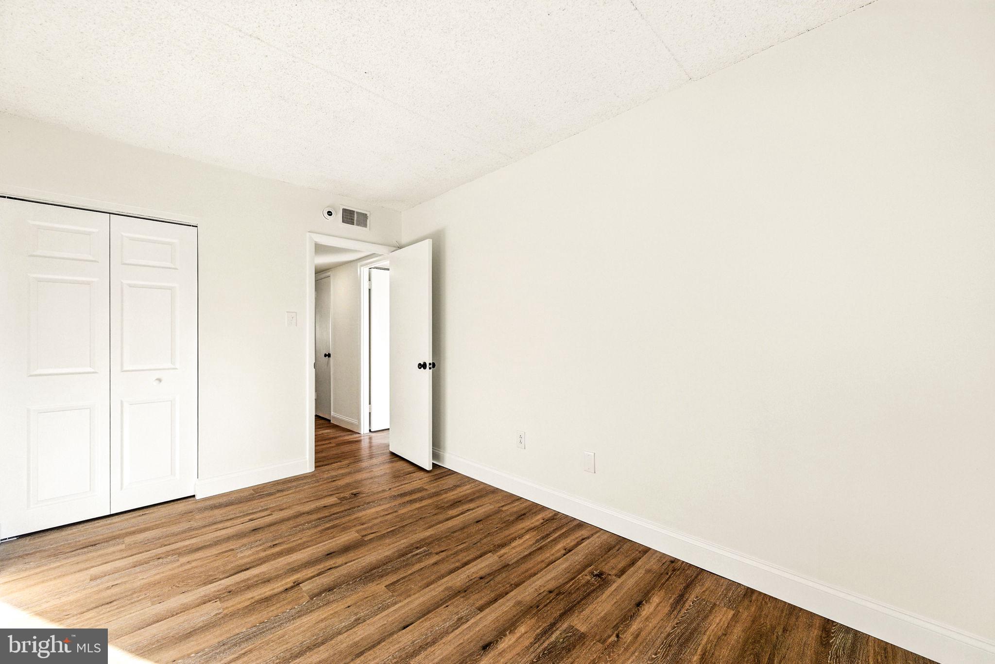 338 Saybrook Lane Wallingford, PA 19086 - Photo 18 of 30 a view of an empty room with wooden floor
