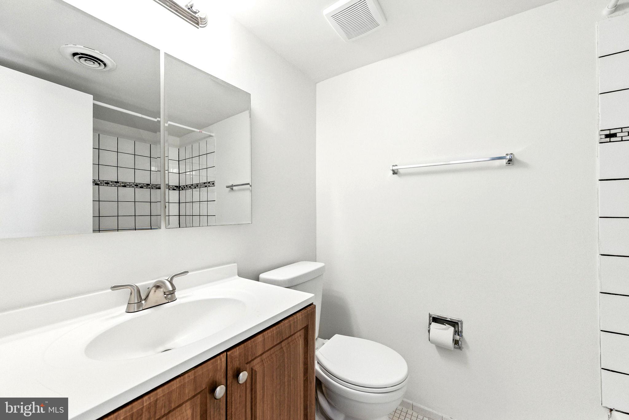 338 Saybrook Lane Wallingford, PA 19086 - Photo 22 of 30 a bathroom with a sink a toilet and shower