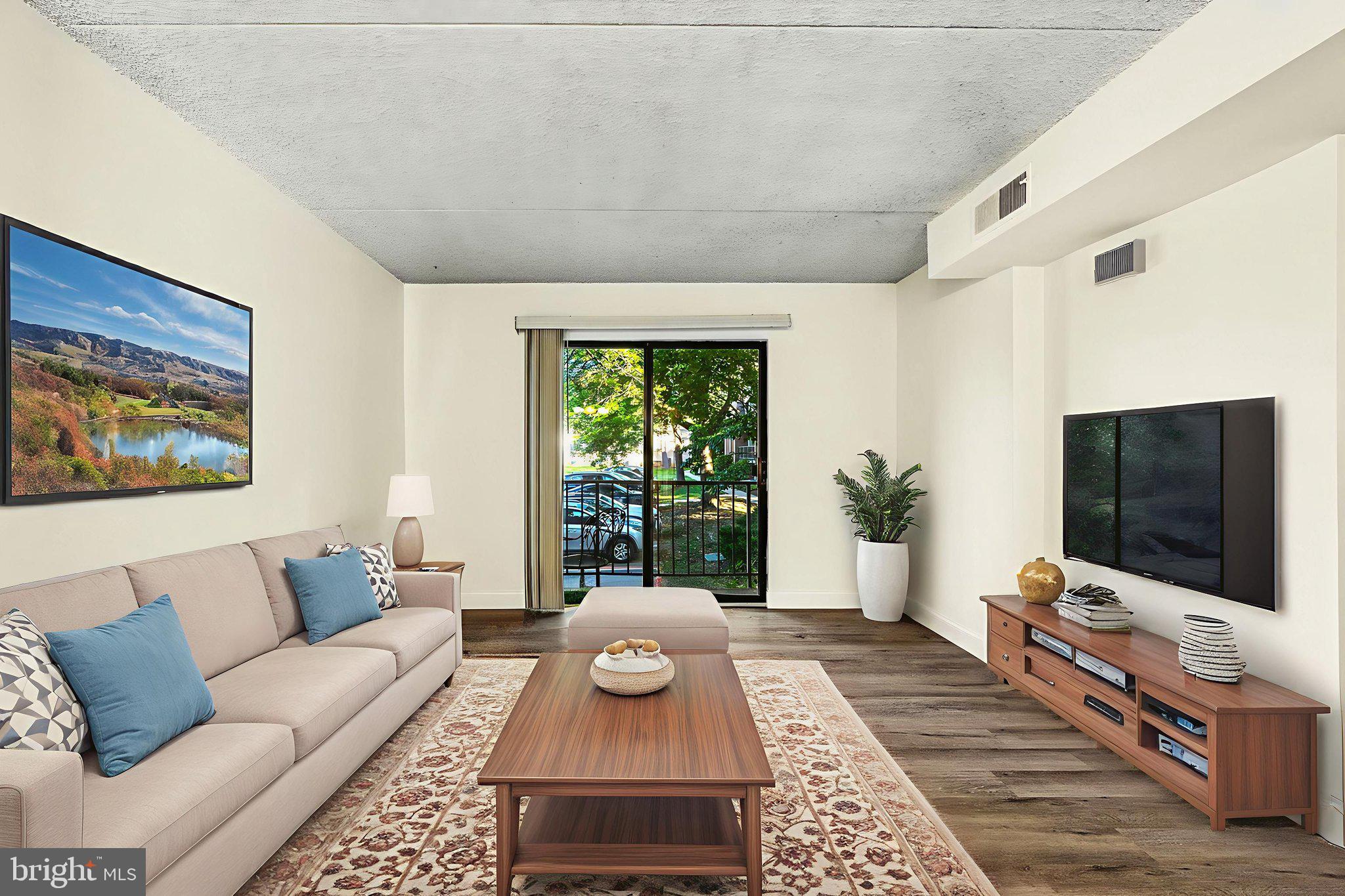 338 Saybrook Lane Wallingford, PA 19086 - Photo 5 of 30 a living room with furniture and a flat screen tv