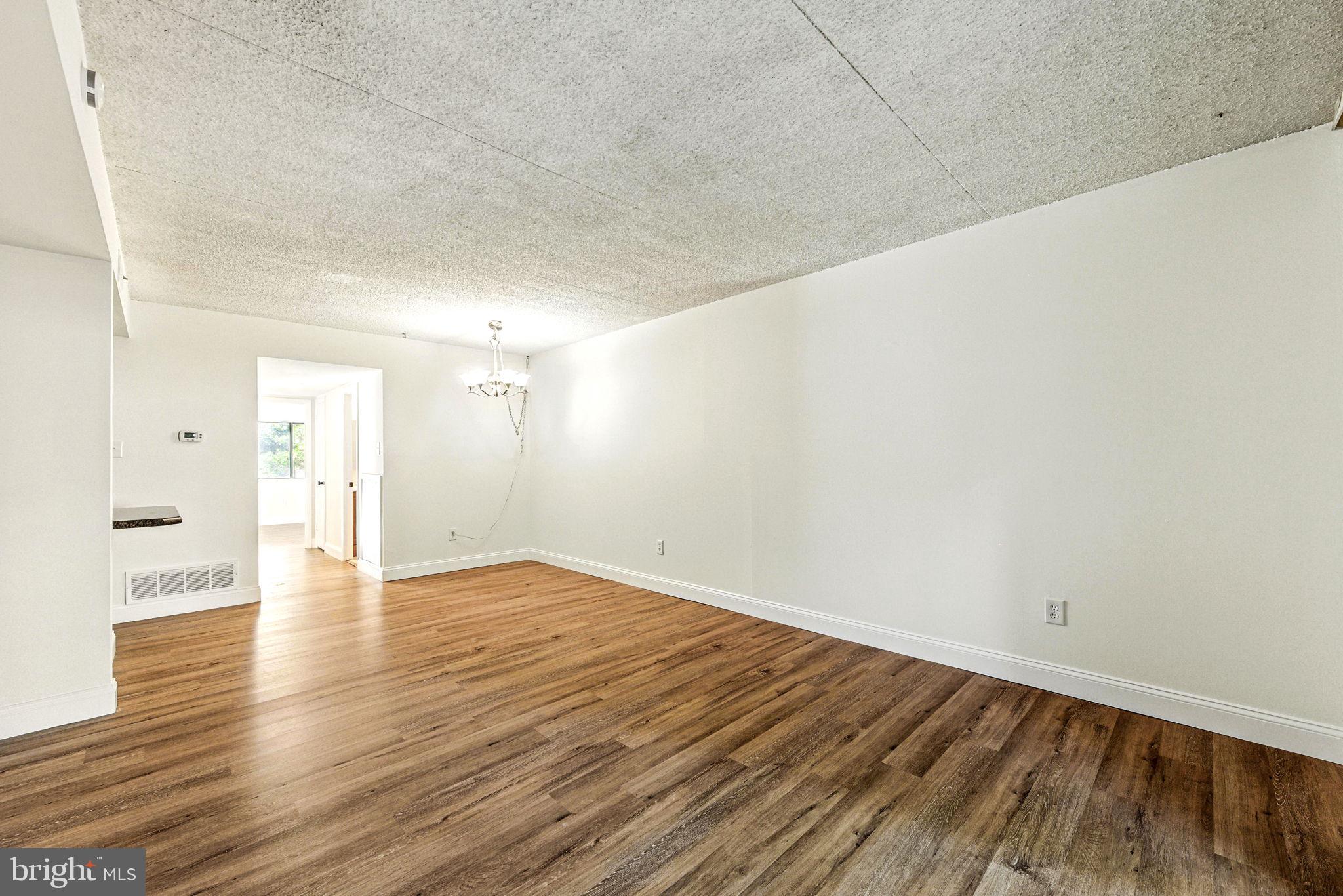 338 Saybrook Lane Wallingford, PA 19086 - Photo 8 of 30 a view of an empty room and wooden floor