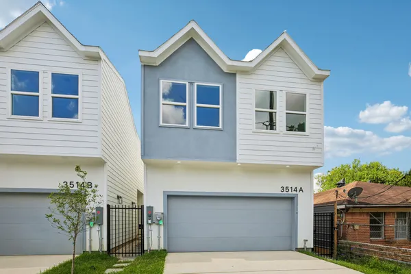 a front view of a house with a garage