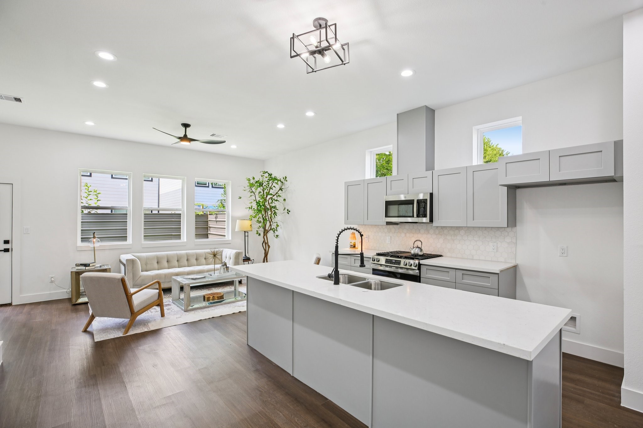 6739 Liverpool Street Houston, TX 77021 - Photo 8 of 27 a kitchen with a sink cabinets and wooden floor
