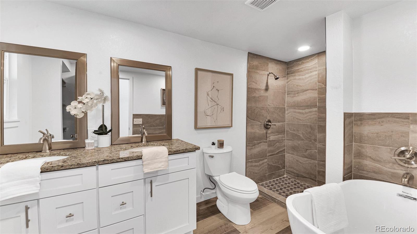 660 Meade Street Denver, CO 80204 - Photo 19 of 25 a bathroom with a granite countertop sink toilet and shower
