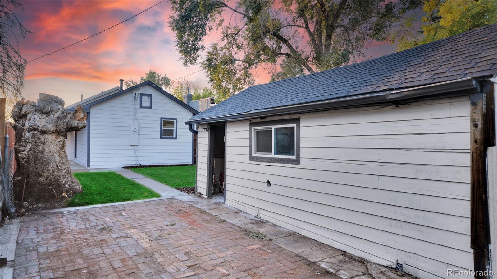 660 Meade Street Denver, CO 80204 - Photo 25 of 25 a front view of a house with a yard