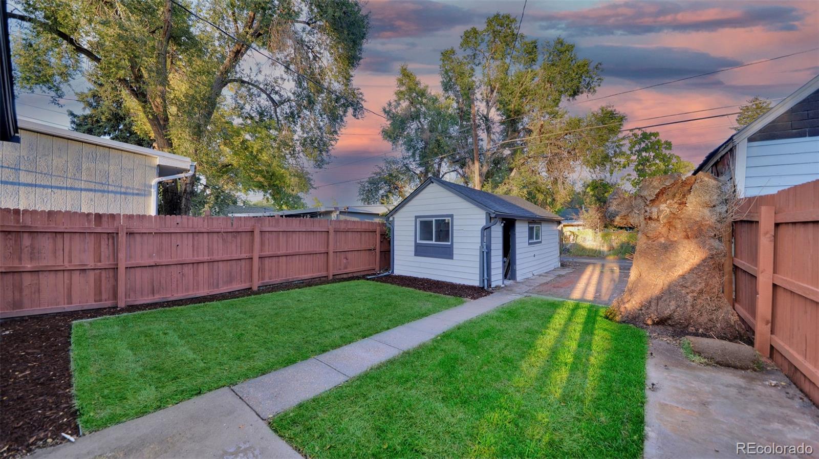 660 Meade Street Denver, CO 80204 - Photo 4 of 25 a front view of a house with garden