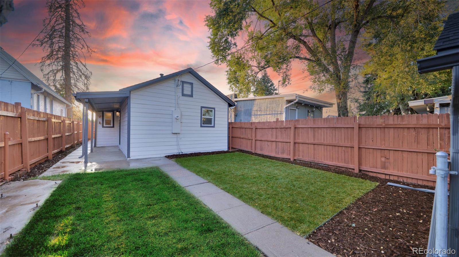 660 Meade Street Denver, CO 80204 - Photo 5 of 25 a view of a backyard with wooden fence