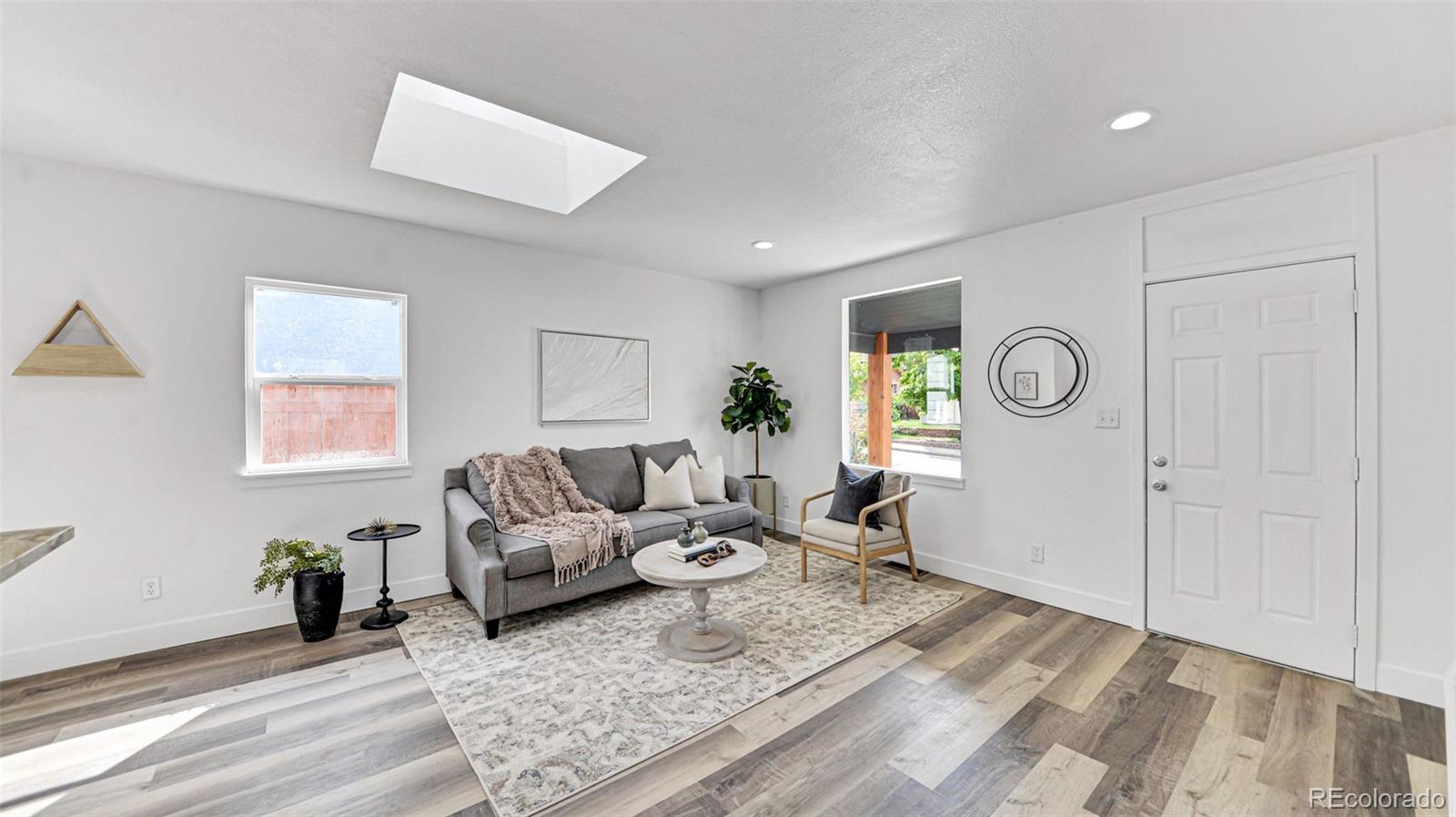 660 Meade Street Denver, CO 80204 - Photo 9 of 25 a living room with furniture and a window