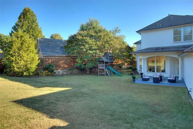 a view of a house with a yard porch and sitting area