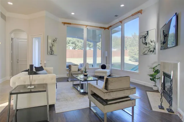 a living room with furniture fireplace and flat screen tv